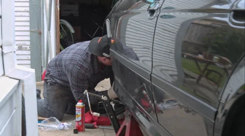 Mechanic Doing A Brake Job On An E39 Bmw 540I Video stock 49095850
