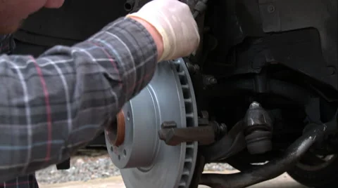 Mechanic Doing A Brake Job On An E39 Bmw 540I Stock Footage 49095866