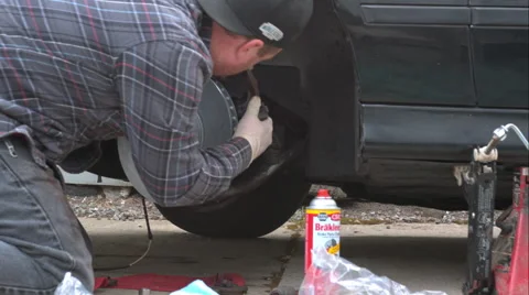 Mechanic Doing A Brake Job On An E39 Bmw 540I Video stock 49096039