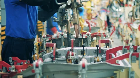 Mechanic is doing spot welding of a car element. Automobile factory, car Vídeo Stock 141120892