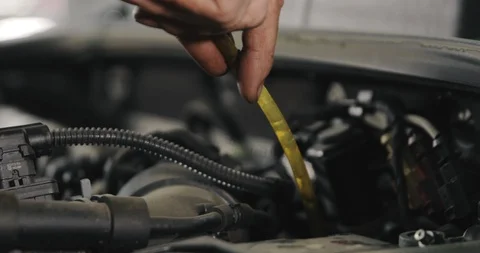 Mechanic Draining Old Brake Fluid From A System During The Service. Close Up Video stock 124956003