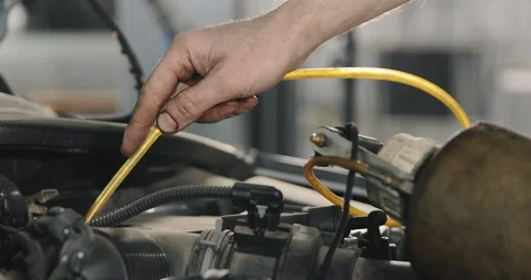 Mechanic Draining Old Brake Fluid From A System During The Service. Close Up Video stock 124956155