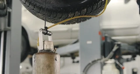 Mechanic Draining Old Brake Fluid From A System. Detail Shot Of The Jar Video stock 124957794