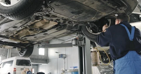 Mechanic Draining Old Brake Fluid From A System During The Service. Video stock 124958270