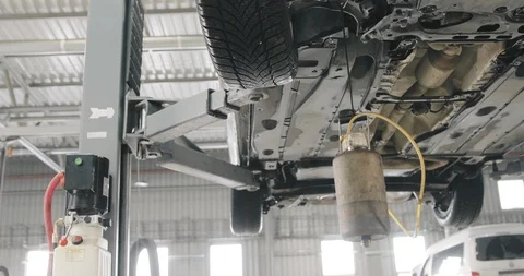 Mechanic Draining Old Brake Fluid From A System. Detail Shot Of The Canister.  Video stock 124986456