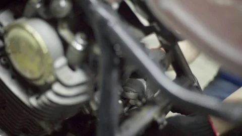 Mechanic during chopper custom exhaust fabrication Stock Footage 128919787