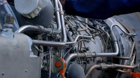 Mechanic engine expert shows the design of a helicopter engine, the mechanical Stock Footage 218161552