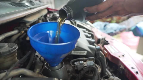 Mechanic engineer change engine oil Stock Footage 248237812