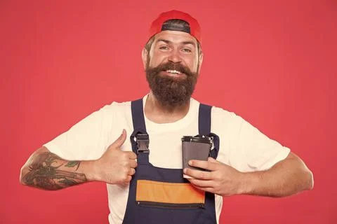 Mechanic enjoy coffee. Handsome builder hold coffee cup. Is Coffee Break the Stock Photos