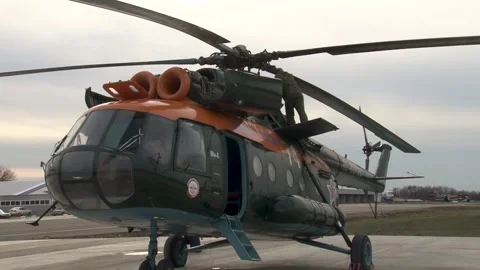 Mechanic examines engines of Mi-8 helicopter (Hip) after flight. Video stock 139761523