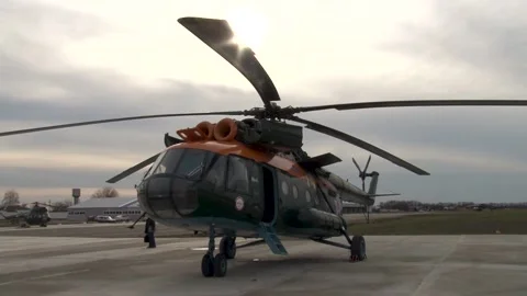 Mechanic examines engines of Mi-8 helicopter (Hip) after flight. Stock Footage 139761755
