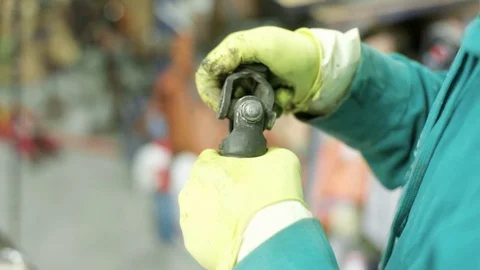 Mechanic figuring out problem with ball bearing cross joint Stock Footage 128921194