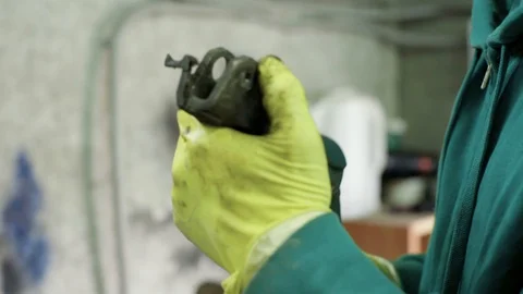 Mechanic figuring out problem with ball bearing cross joint Stock Footage 128921586