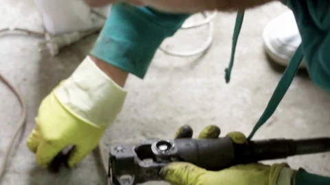 Mechanic figuring out problem with ball bearing cross joint Stock Footage 128921638