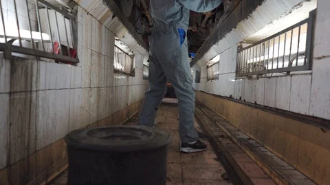 A mechanic fixes a car in the pit Stock Footage 102868034