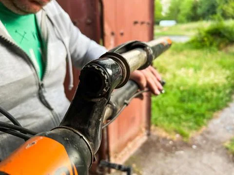 Mechanic fixing broken bicycle stem in workshop Stock Photos