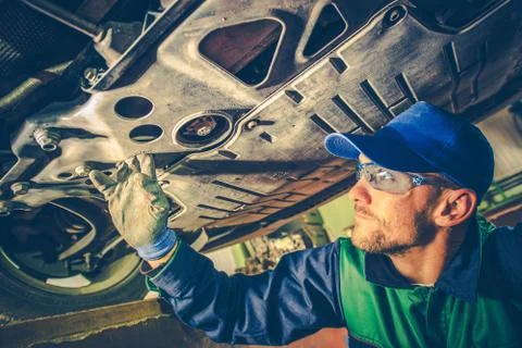 Mechanic fixing the car Stock Photos