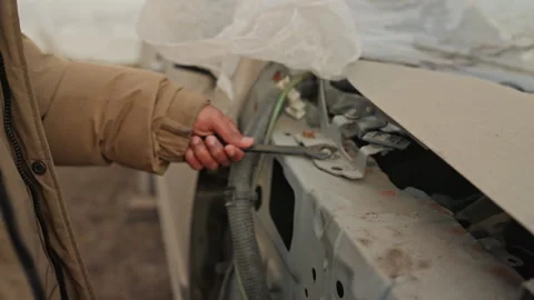 Mechanic fixing car with tools. Close shot of hand repairing vehicle panel Stock Footage 332501663