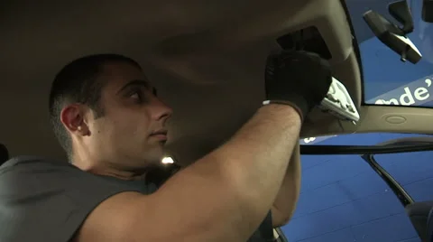 Mechanic fixing electrical system on a car Stock Footage 43541802