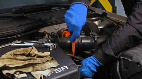 Mechanic gets angry while repairing car engine Stock Footage 61627869