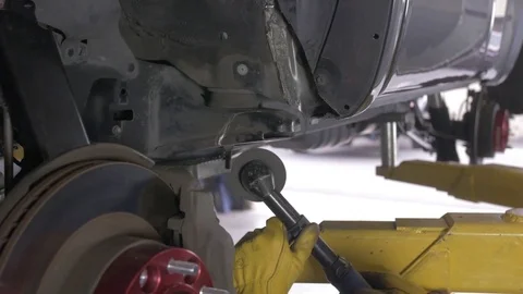 Mechanic grinding on a vehicle Stock Footage 77148987