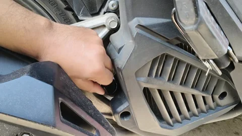 Mechanic hand checking engine component on scooter motorcycle 库存影片 348708742