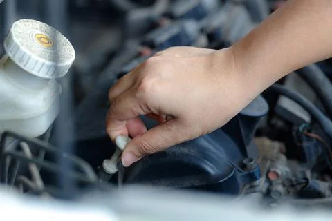 Mechanic Hand Checking Engine Oil Level Stock Photos