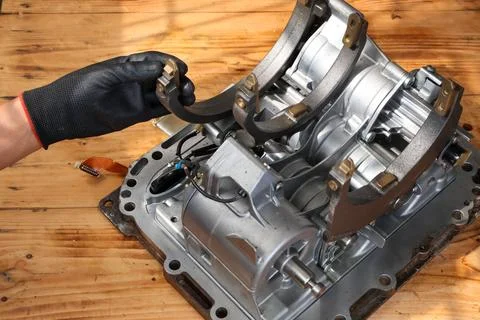 Mechanic Hand Checking Shift Fork on Transmission Mechatronic Unit. Stock Photos
