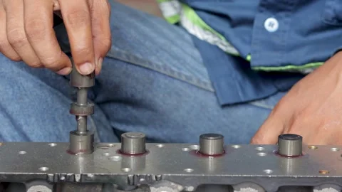 Mechanic Hand Inserting Spool Valve Shaft Into Hydraulic Control Valve Body. Stock Footage 344688373