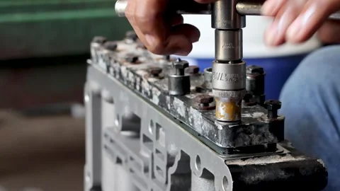 Mechanic Hand Inserting Spool Valve Shaft Into Hydraulic Control Valve Body. Stock Footage 344688418