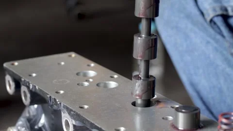 Mechanic Hand Inserting Spool Valve Shaft Into Hydraulic Control Valve Body. Stock Footage 344688427