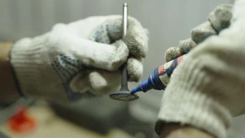Mechanic hands in gloves applying valve lapping paste onto valve Video stock 340273722
