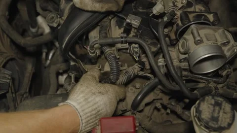 Mechanic hands in gloves inspecting and repairing a dusty car engine intake Stock Footage 340559281