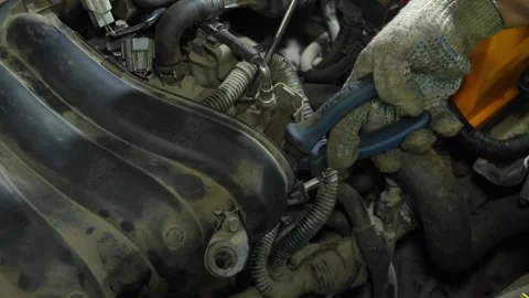 Mechanic hands in gloves using pliers to repair car engine components Stock Footage 340335072