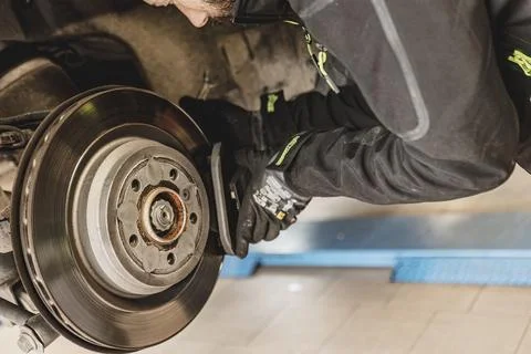 Mechanic Hands Replace Brake Pads on Car Stock Photos