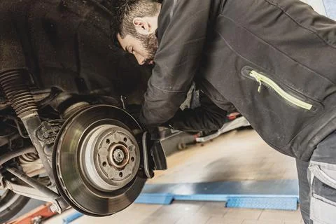 Mechanic Hands Replace Brake Pads on Car Stock Photos