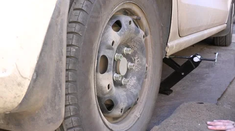 Mechanic Hands Replace Car Tire Outdoor. Closeup. 4K UltraHD, UHD Stock Footage 60239791