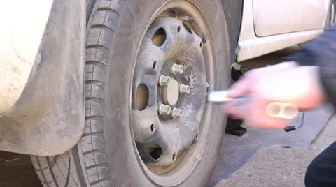 Mechanic Hands Replace Car Tire Outdoor. Closeup. 4K UltraHD, UHD Stock Footage 60239840