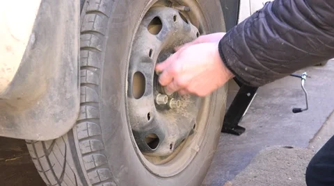 Mechanic Hands Replace Car Tire Outdoor. Closeup. 4K UltraHD, UHD Stock Footage 60239866