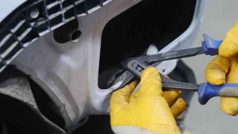Mechanic hands in rubber gloves repairs car body after accident Video stock 324710661
