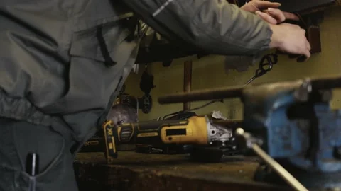 Mechanic at his workbench struggles with a socket that has bad contacts Stock Footage 236974628