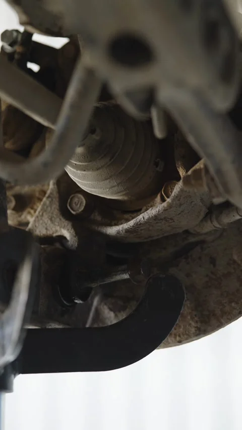 Mechanic hitting car suspension part with hammer in motion blur Stock Footage 337568570