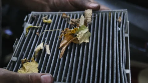 Mechanic holds cabin filter preparing element for replacement Video stock 317651852