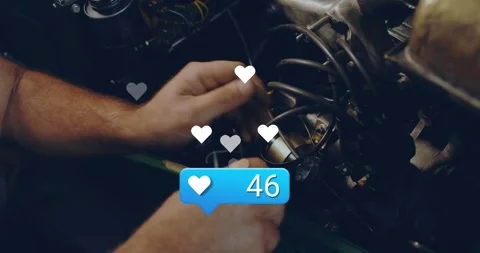 Mechanic inserting hands in engine bay and tuning cap as animated hearts and Stock Footage 320067475