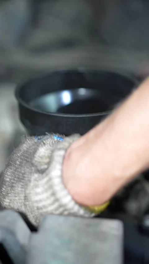 Mechanic Inspecting Ball Joint During Auto Maintenance in Workshop Setting Stock Footage 346120056