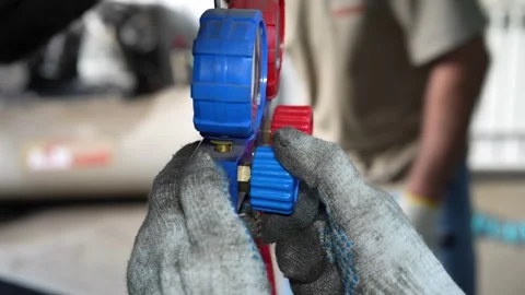 Mechanic Inspecting Ball Joint on Vehicle Suspension During Maintenance Work Stock Footage 346338598