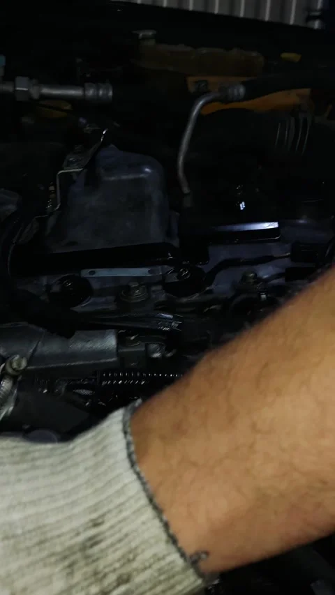Mechanic Inspecting Control Arm on Car Suspension in Auto Workshop Stock Footage 346339587