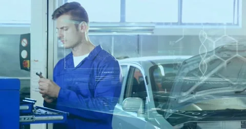 Mechanic inspecting part in auto workshop, overlay showing torque data, flashing Stock Footage 330114663