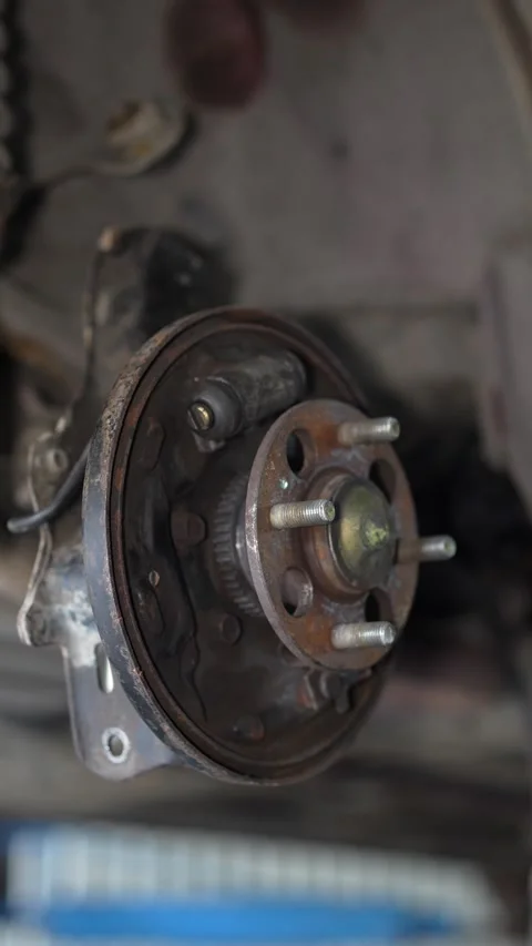 Mechanic Inspecting Rusty Brake Disc on Car Wheel Hub Stock Footage 345564974