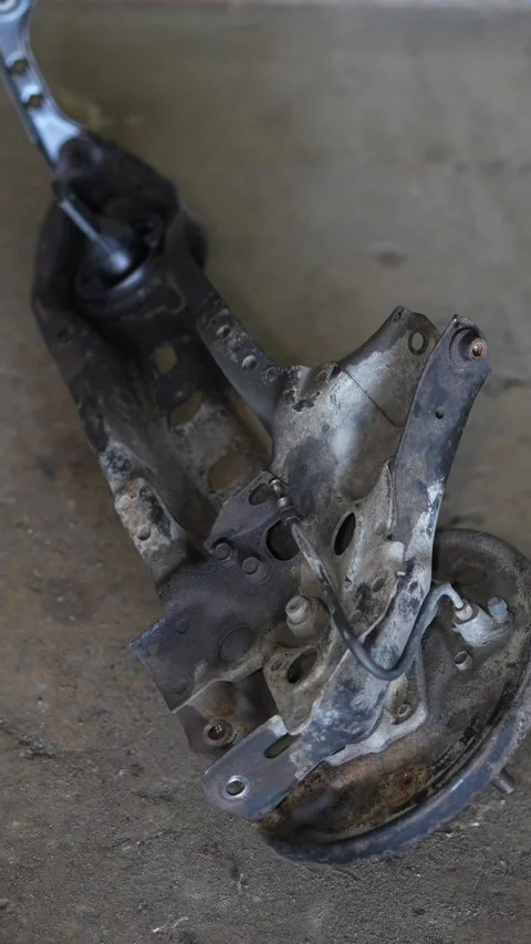 Mechanic Inspecting Rusty Suspension Control Arms in Garage Stock Footage 345563791